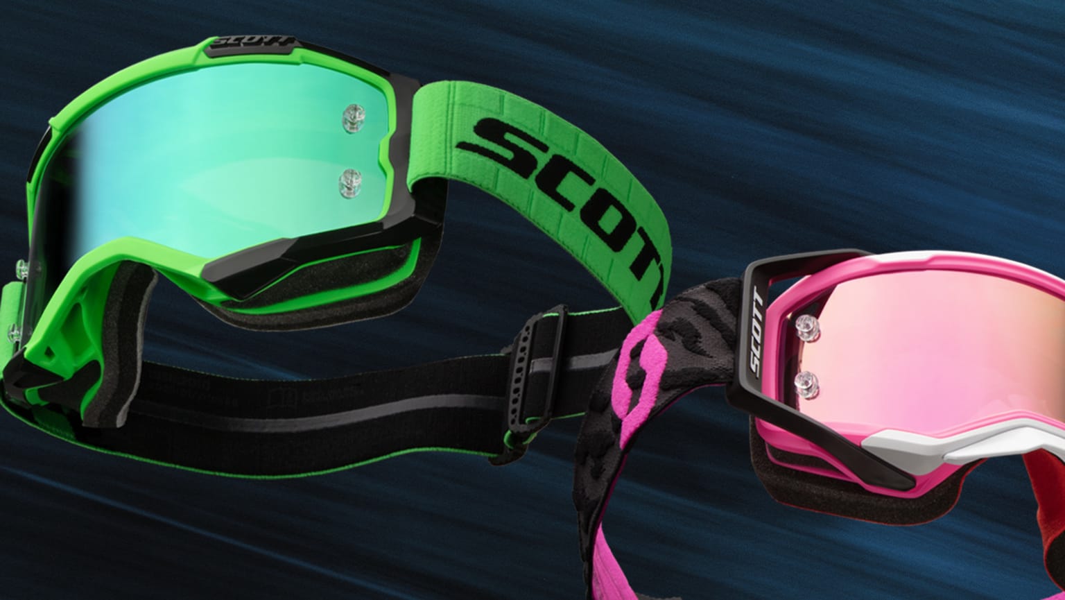 Two pairs of motocross goggles, one green and one pink, are displayed against a dark blue, textured background.
