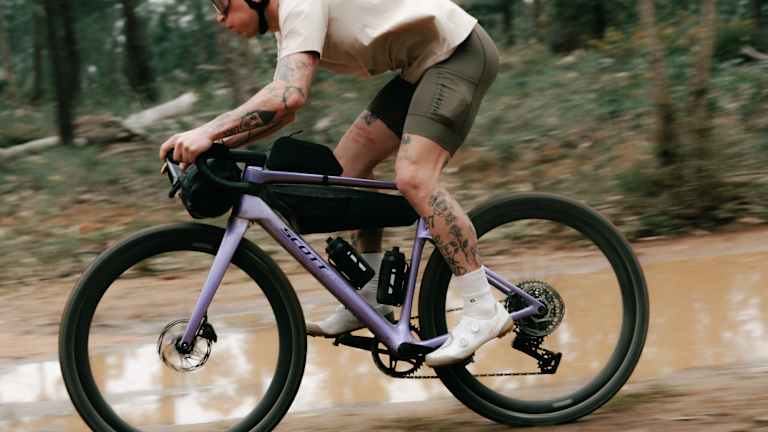 Cyclist riding a Scott bike with Syncros bike parts and components