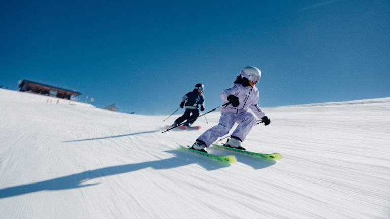 Kids skiing on a groomer in Scott children's ski gloves