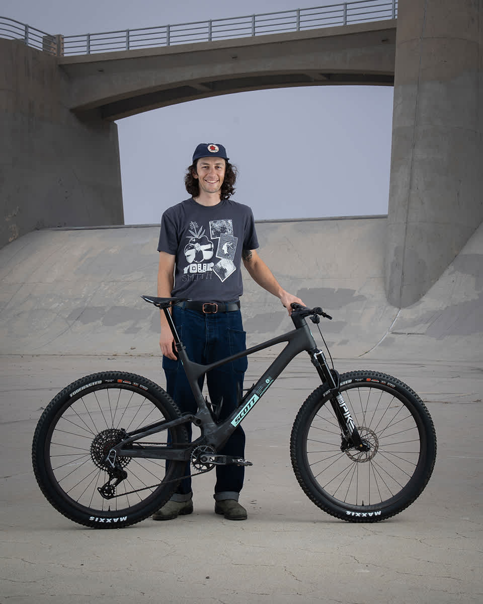 Portrait of Alex Colorito standing with a SCOTT Spark bike